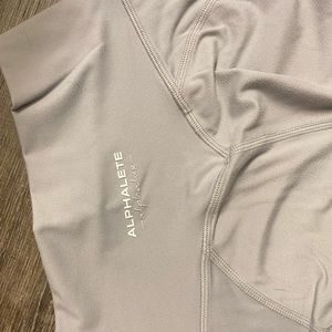 Alphalete “Alphalux” light gray leggings.